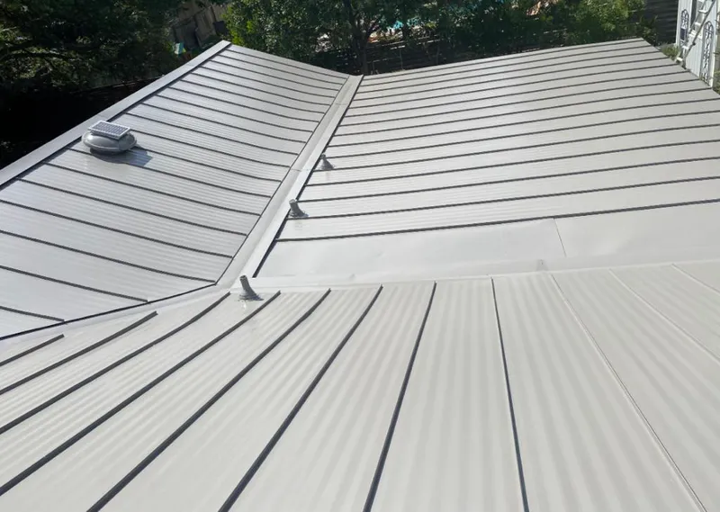 Solar attic fan installed on a metal roof for Roof Ventilation in North Richland Hills